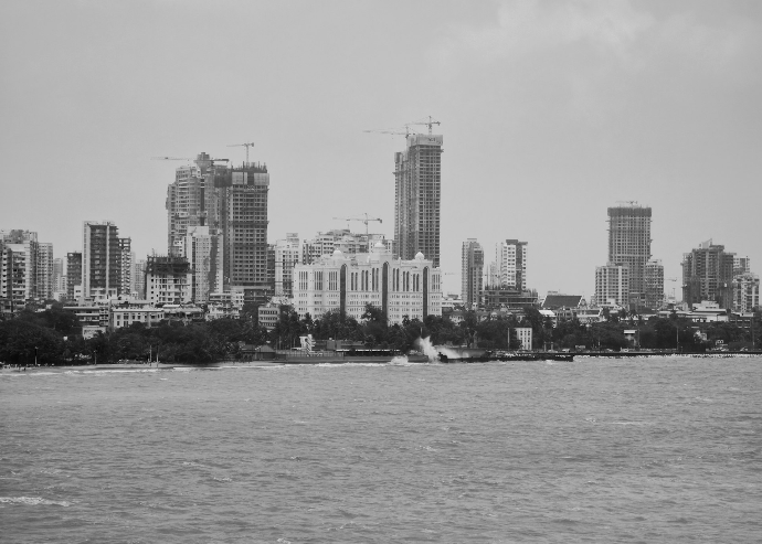 City skyline with buildings near the water.